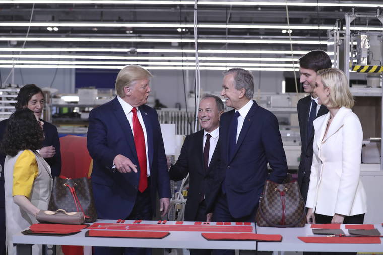 In Texas, Trump tours Louis Vuitton workshop ahead of rally | The Garden Island