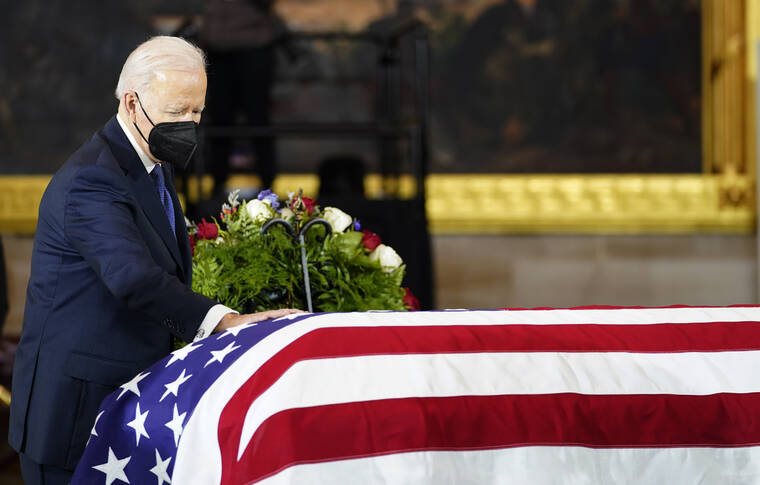 Biden pays silent tribute as Reid lies in state at Capitol