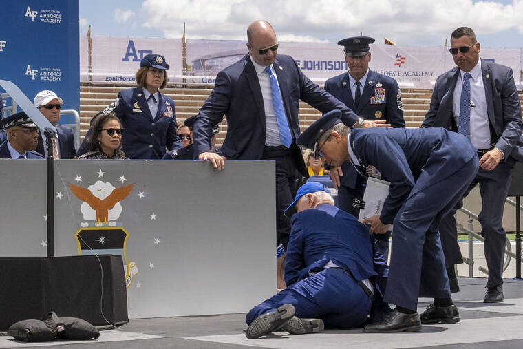 Biden trips and falls onstage at Air Force graduation