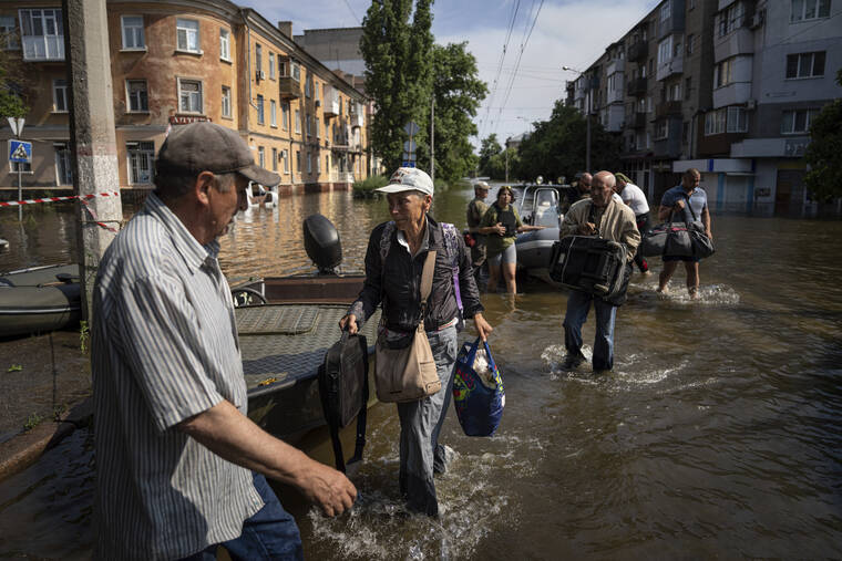 Rescuers are braving snipers in from Russia-occupied flood zones - The ...